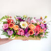 bright flower display arranged in crate